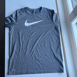 This is a gray dry fit long sleeve from Nike. This shirt is a size boys large.